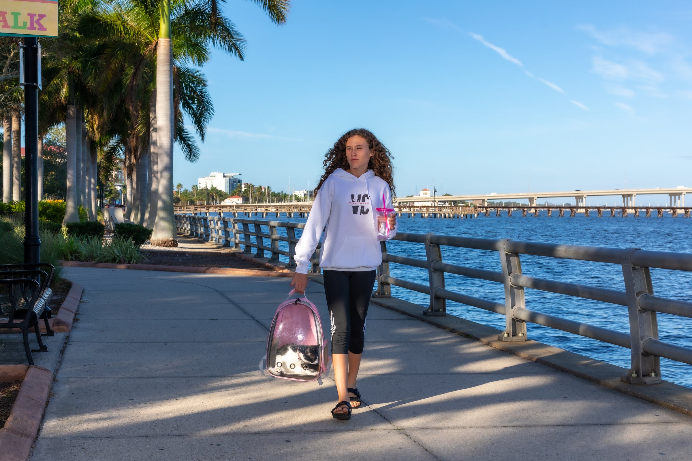 teenager walking with cat