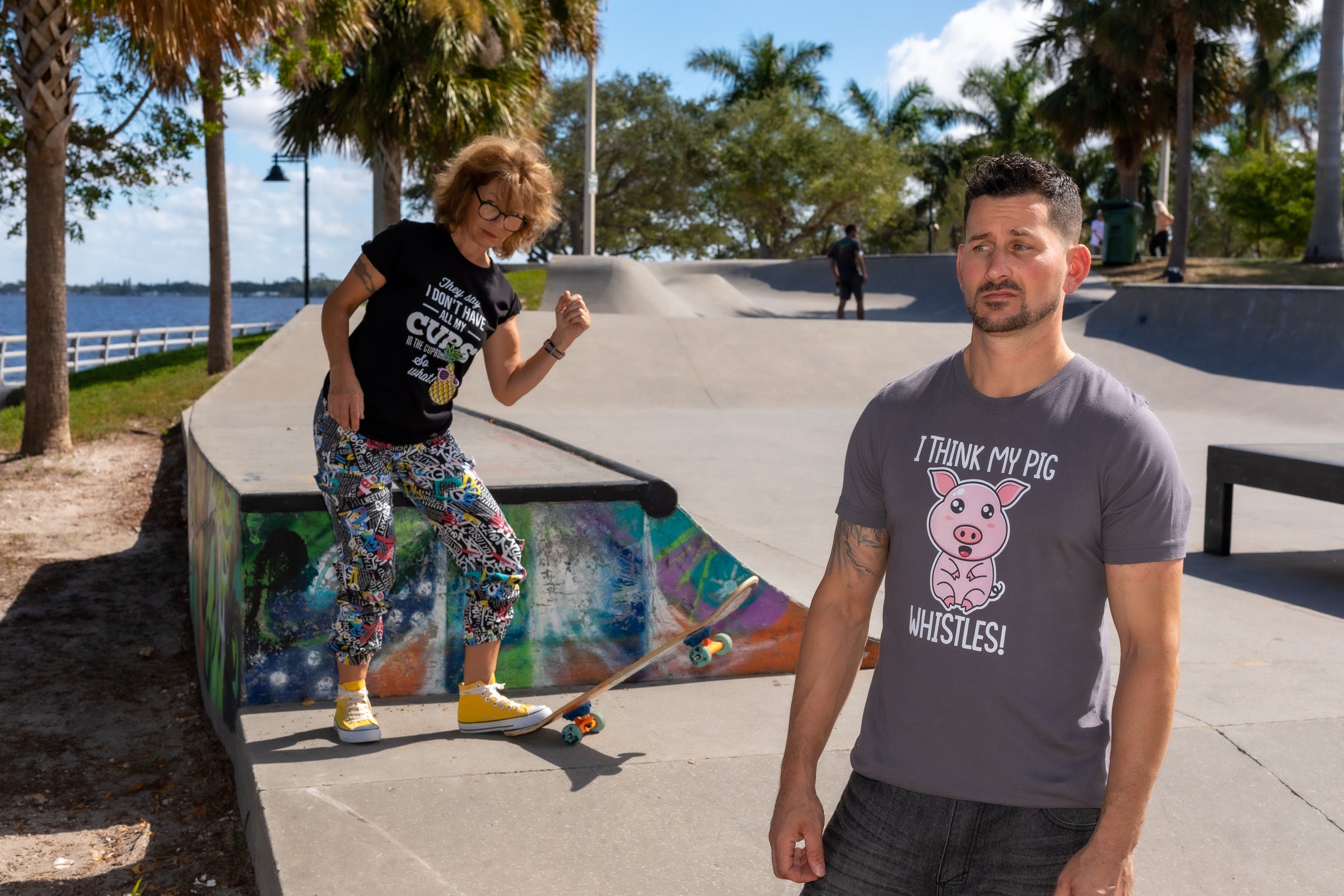 woman on skateboard and guy confused